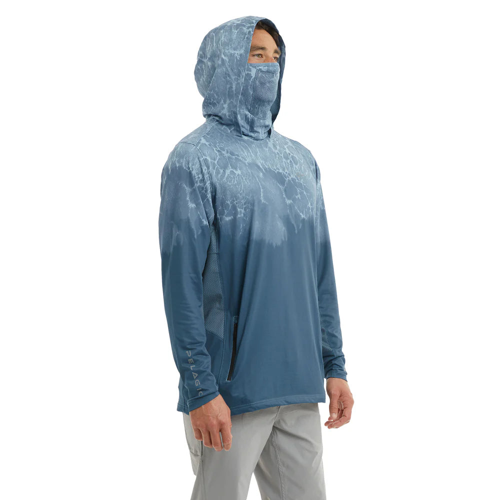 Person wearing a blue hooded fishing shirt with a white pattern on a white background