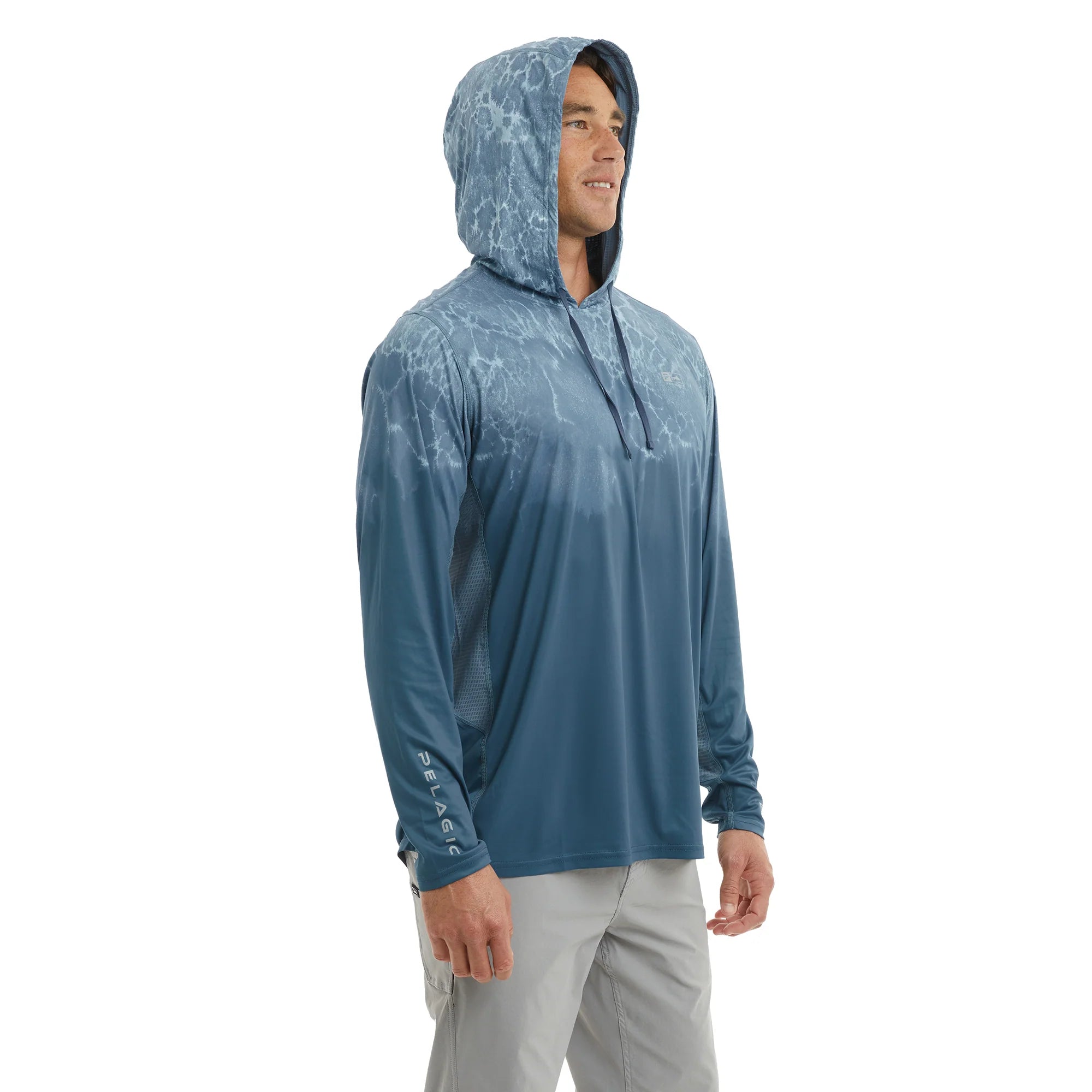 Man wearing a blue Exo-Tech hooded fishing shirt - Pelagic Australia