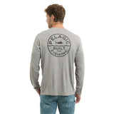 Man wearing a gray long-sleeve shirt with 'Pelagic Built for Fishing' logo on the back.