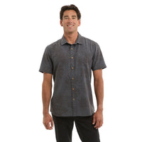 Man wearing a grey patterned shirt 