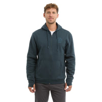Man wearing a dark green zip up fleece hoodie with kangaroo pockets